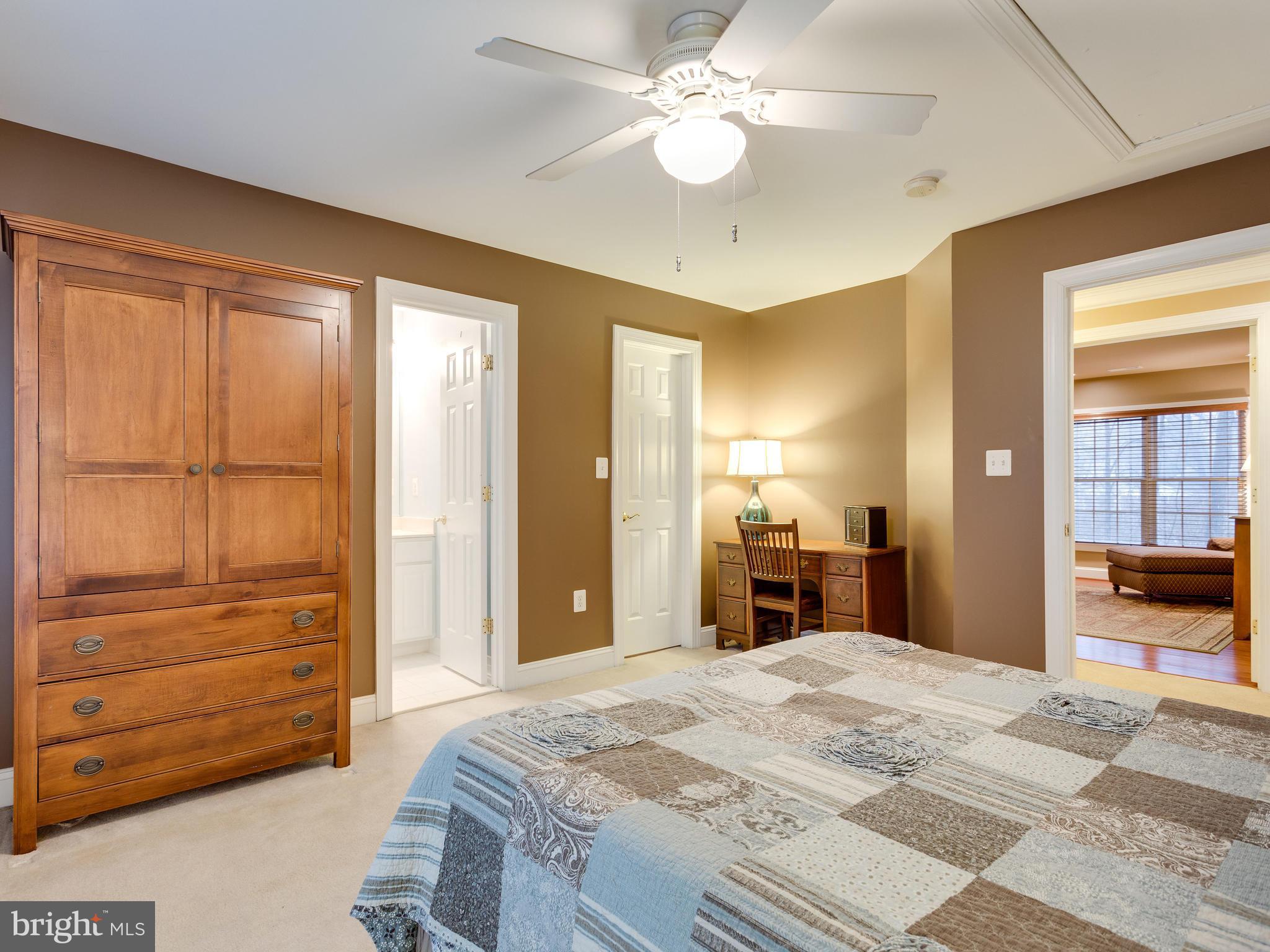4013 Laurel Road Alexandria, VA 22309 - Photo 19 of 30 a bedroom with a bed and a chandelier