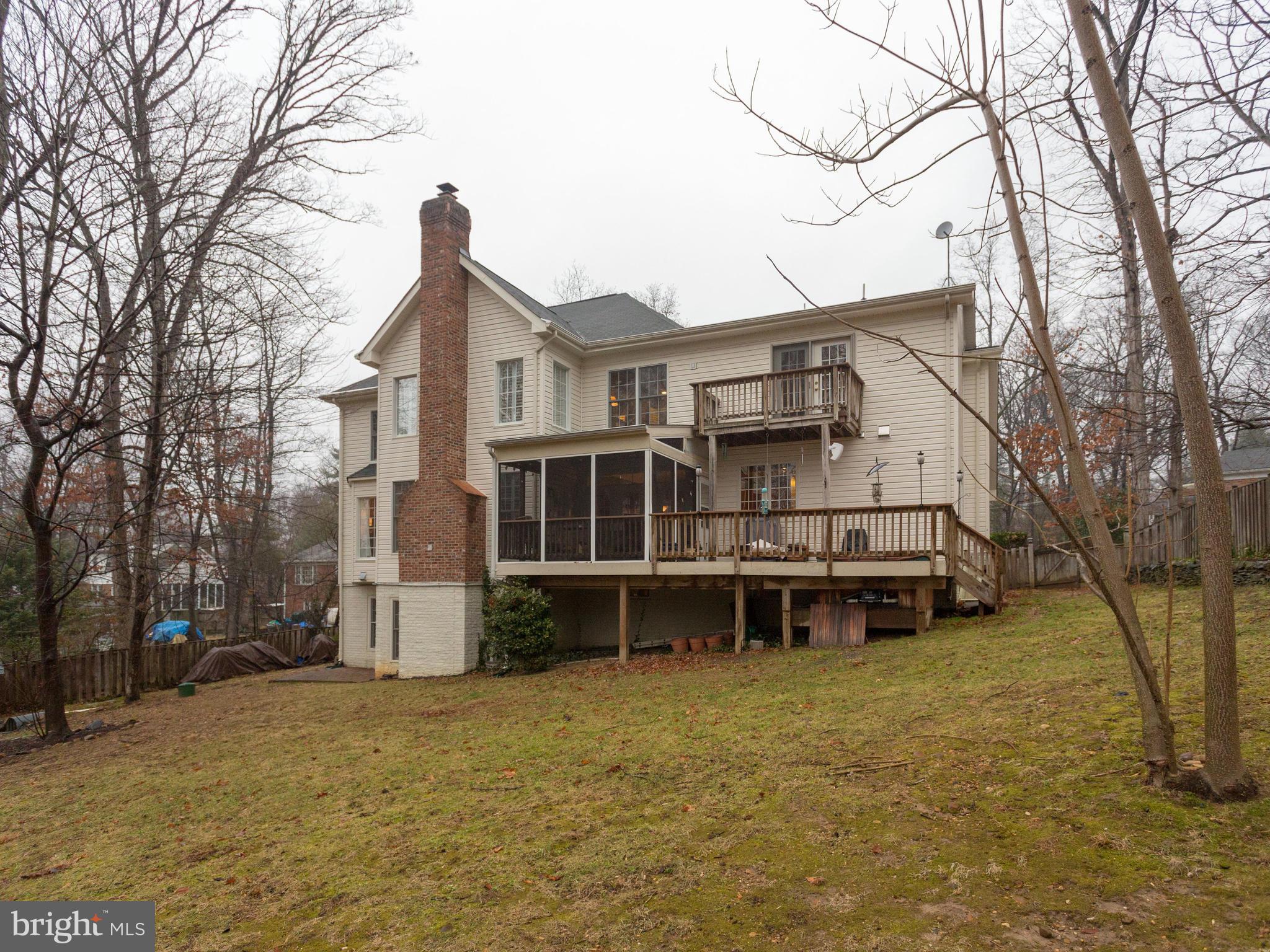 4013 Laurel Road Alexandria, VA 22309 - Photo 30 of 30 a view of a house with a wooden deck and a large tree