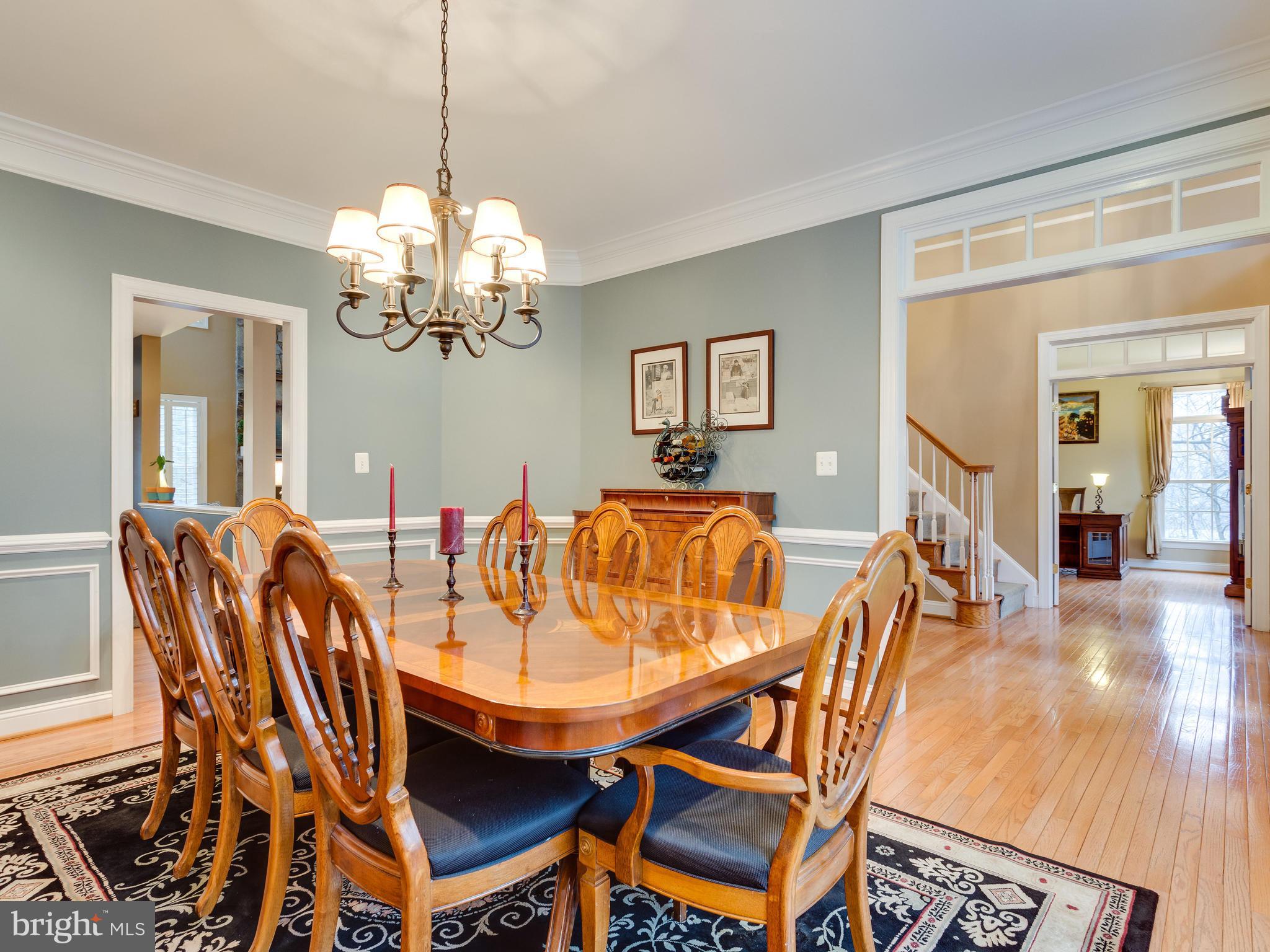 4013 Laurel Road Alexandria, VA 22309 - Photo 5 of 30 a view of a dining room with furniture and a chandelier