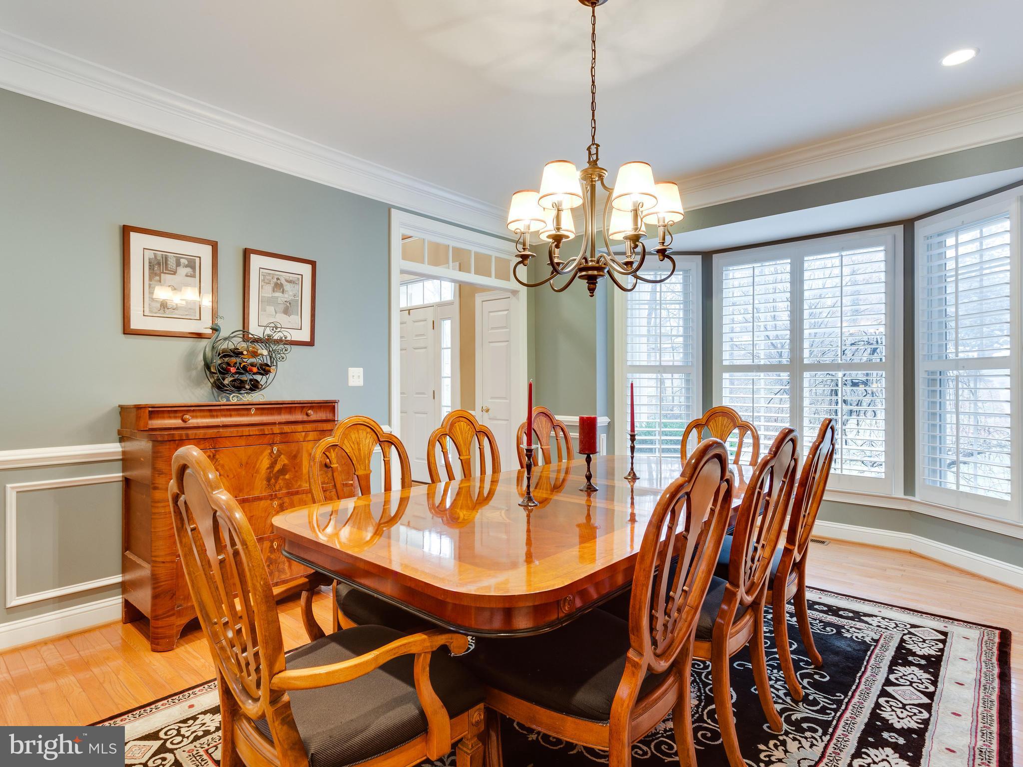 4013 Laurel Road Alexandria, VA 22309 - Photo 6 of 30 a dining room with furniture a chandelier and window