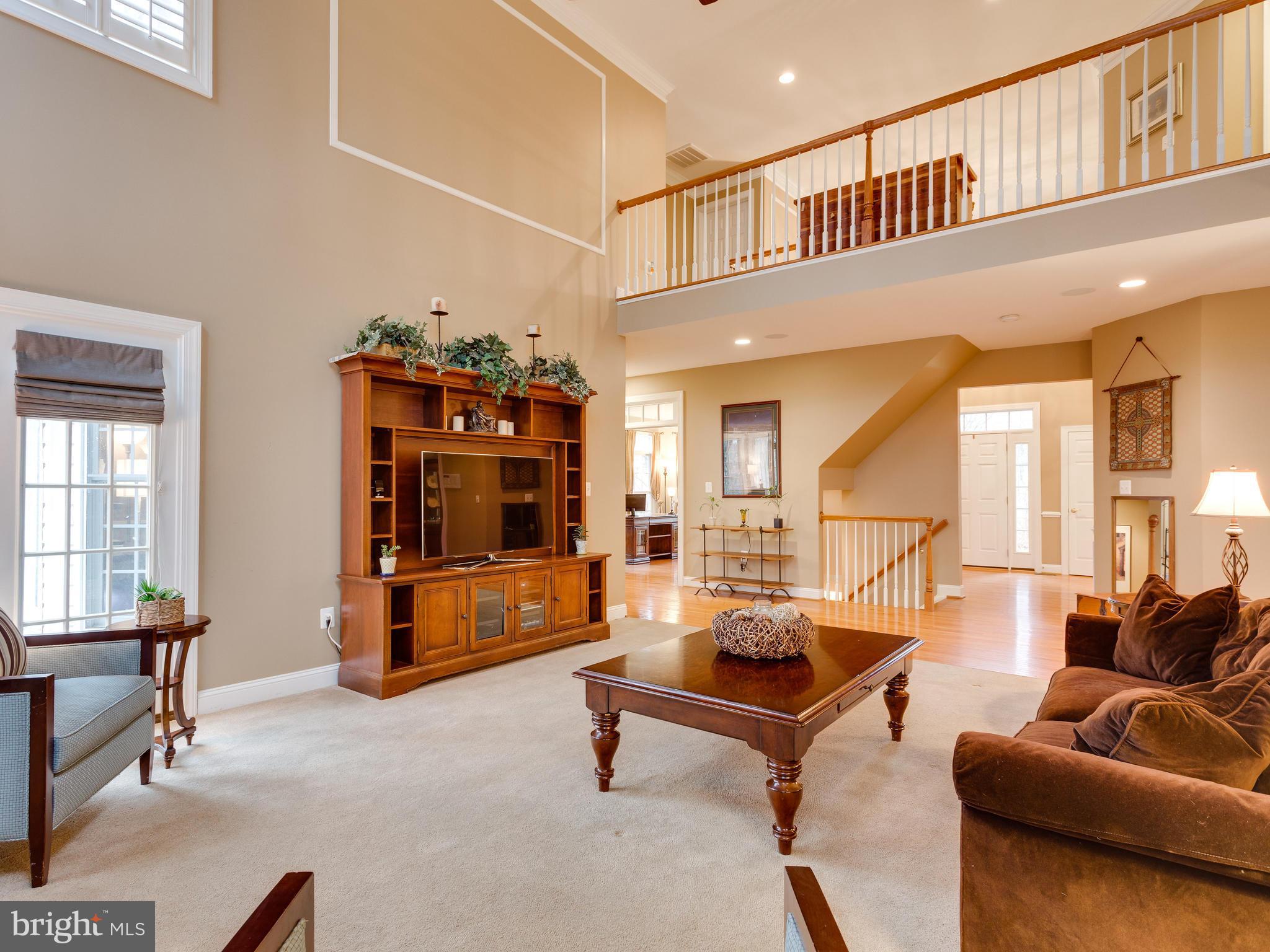 4013 Laurel Road Alexandria, VA 22309 - Photo 9 of 30 a living room with furniture gym equipment and a window