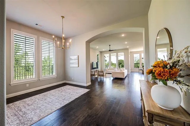 a view of a livingroom with furniture window and wooden floor