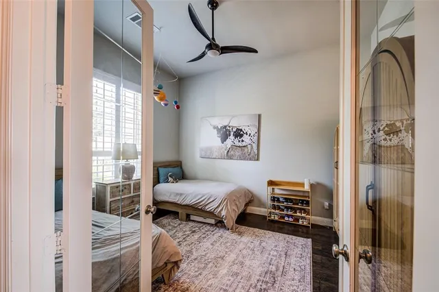a bathroom with a double vanity sink a mirror and a bathtub