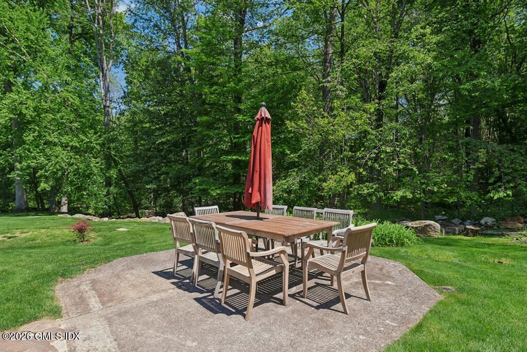 73 Thunder Mountain Road Greenwich, CT 06831 - Photo 17 of 19 a view of a patio with a table and chairs
