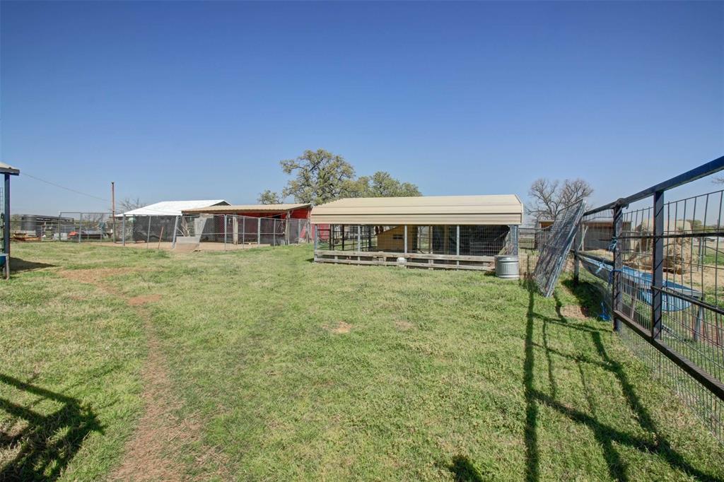3559 Springfield Road Springtown, TX 76082 - Photo 25 of 37 a front view of a house with a yard