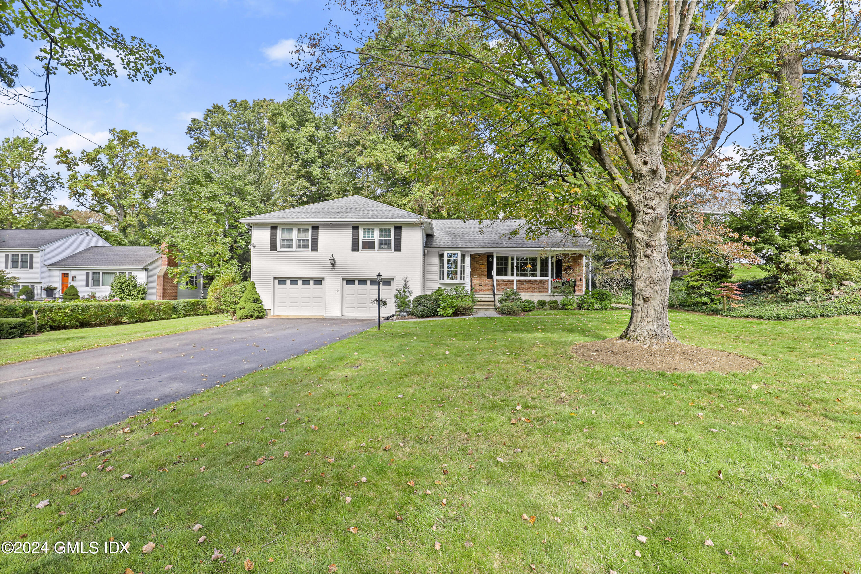 227 Club Road Stamford, CT 06905 - Photo 38 of 56 a front view of a house with garden