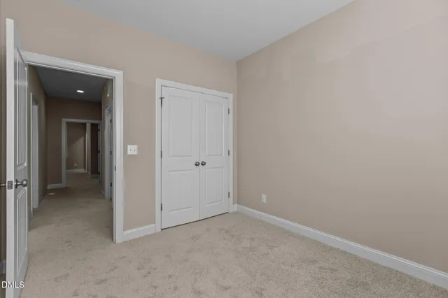 an empty room with closet area