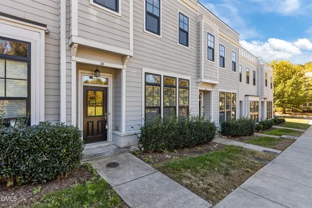 a view of a brick house many windows