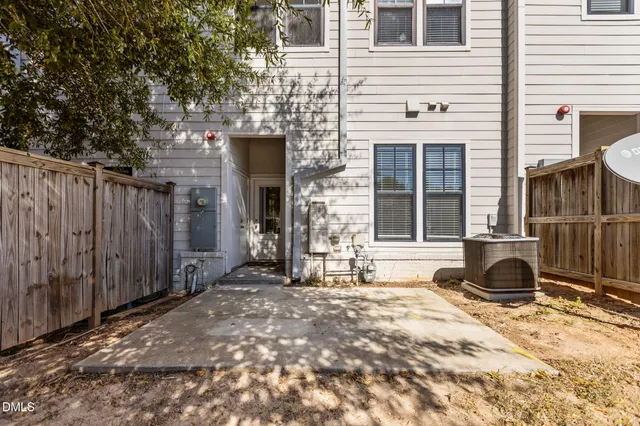 a view of a house with backyard of the house