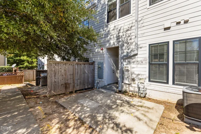 a backyard of a house with barbeque oven