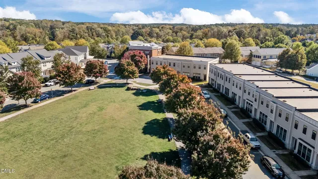 a large building with a mountain in the background