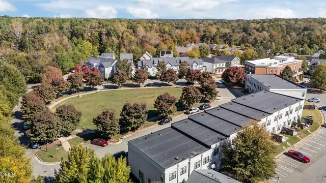 an aerial view of a residential houses with outdoor space