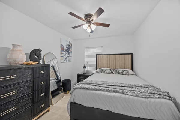 a bedroom with a bed and a dresser
