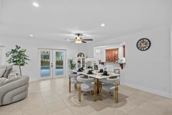 a dining room with furniture and window