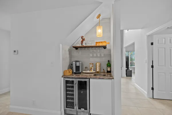 a kitchen with stainless steel appliances a sink and cabinets