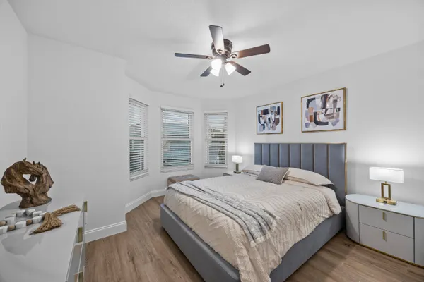 a bedroom with a bed and a table