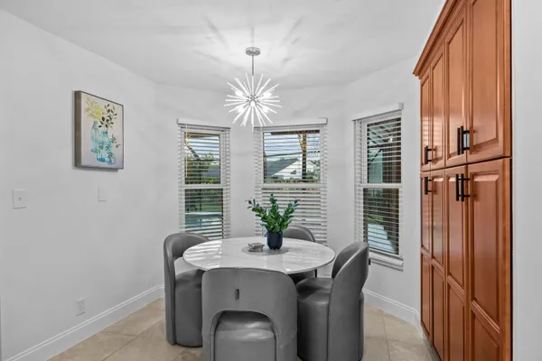 a view of a dining room with furniture window and outside view