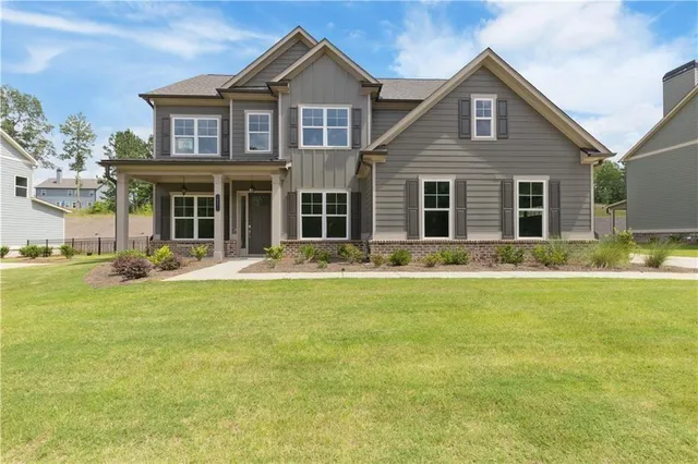 a front view of a house with a yard