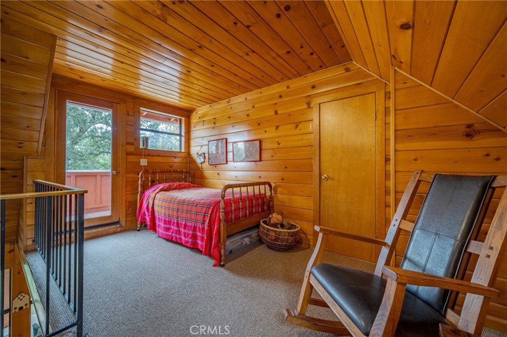 3279 Merced Falls Road Snelling, CA 95369 - Photo 69 of 73 a bedroom with a bed and wooden floor