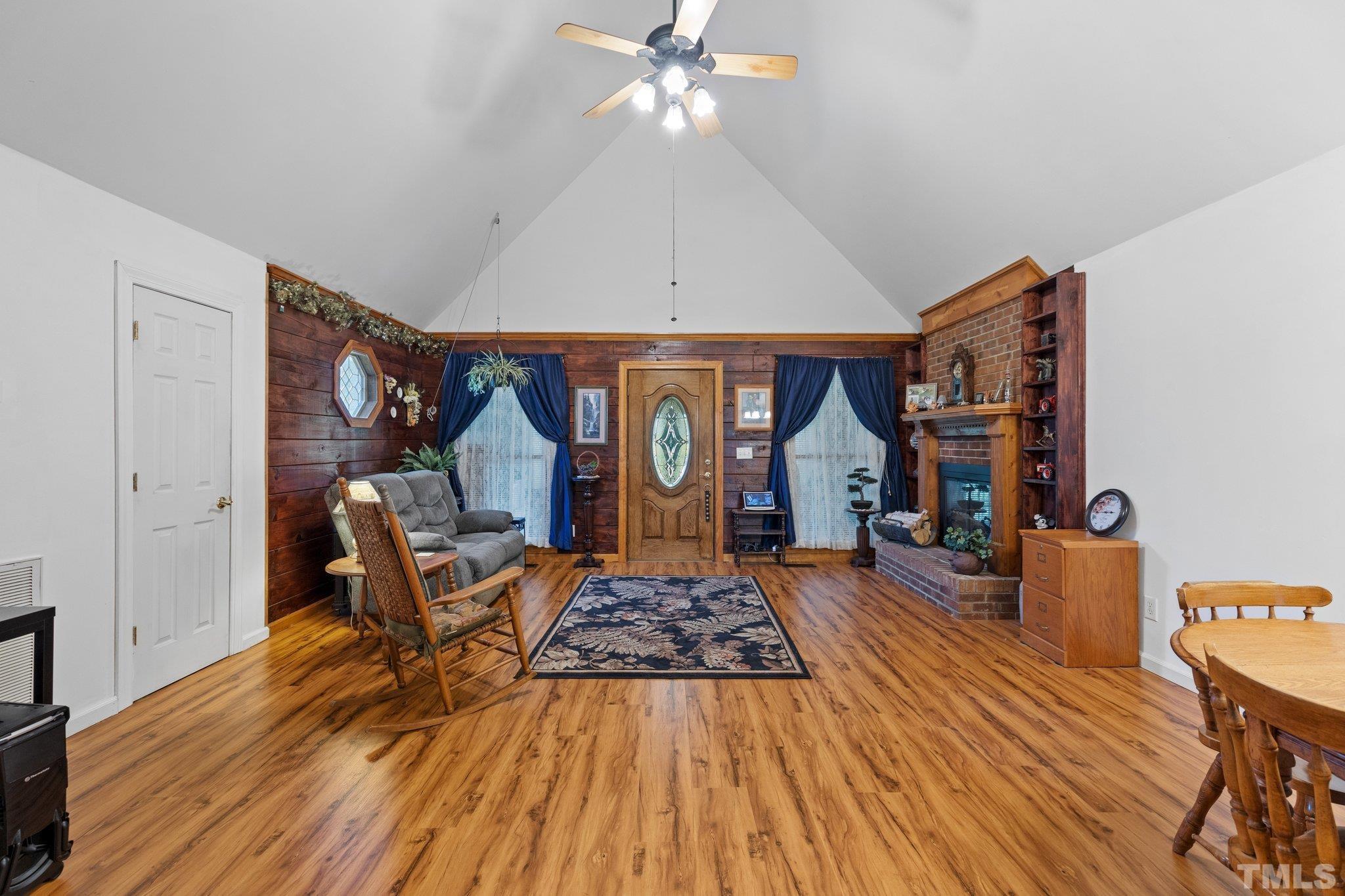 8289 Strickland Road Middlesex, NC 27557 - Photo 8 of 46 a living room with furniture and a wooden floor