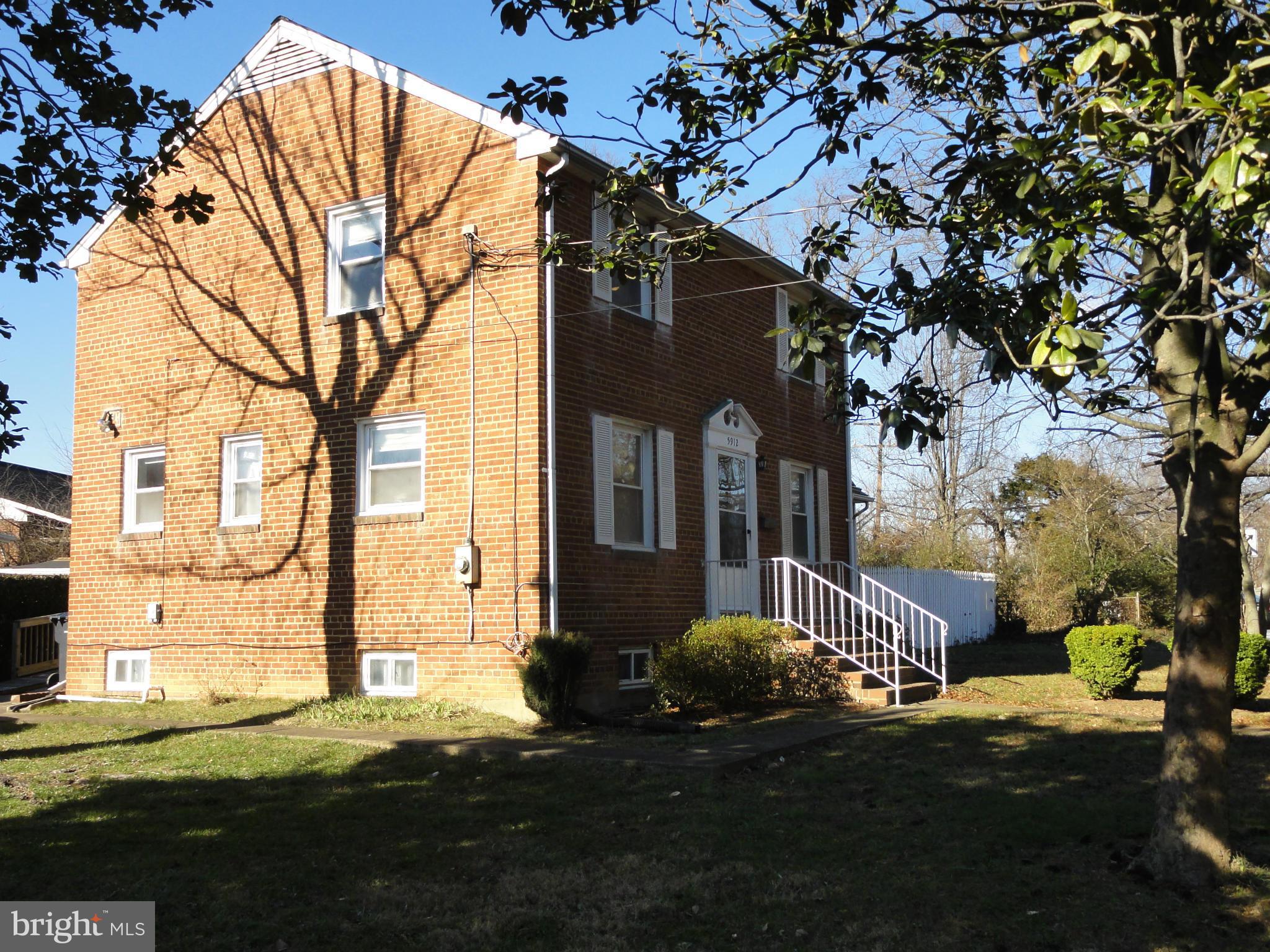 5912 Backlick Road Springfield, VA 22150 - Photo 3 of 28 a front view of a house with a yard