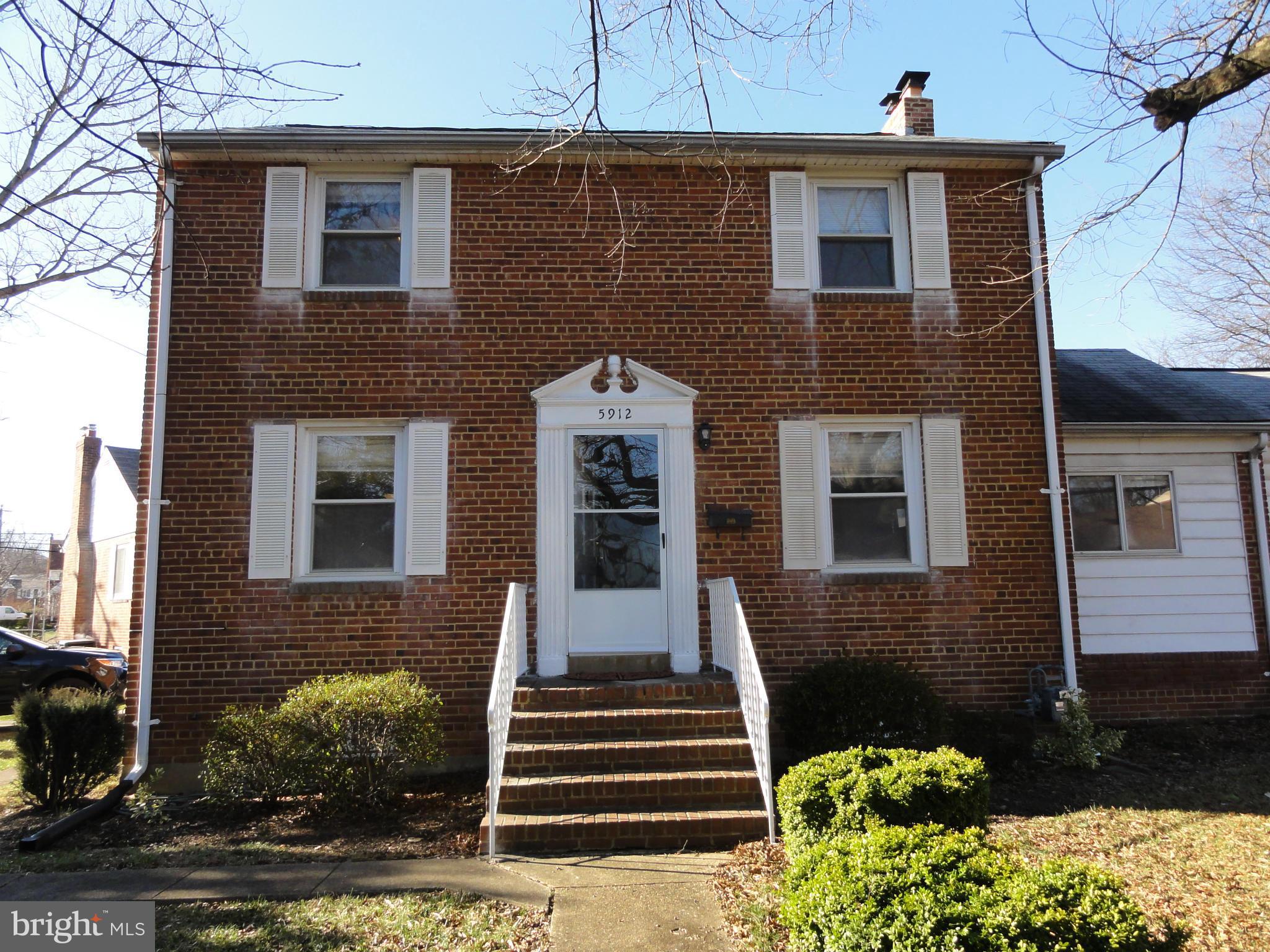 5912 Backlick Road Springfield, VA 22150 - Photo 4 of 28 a front view of a house with a yard