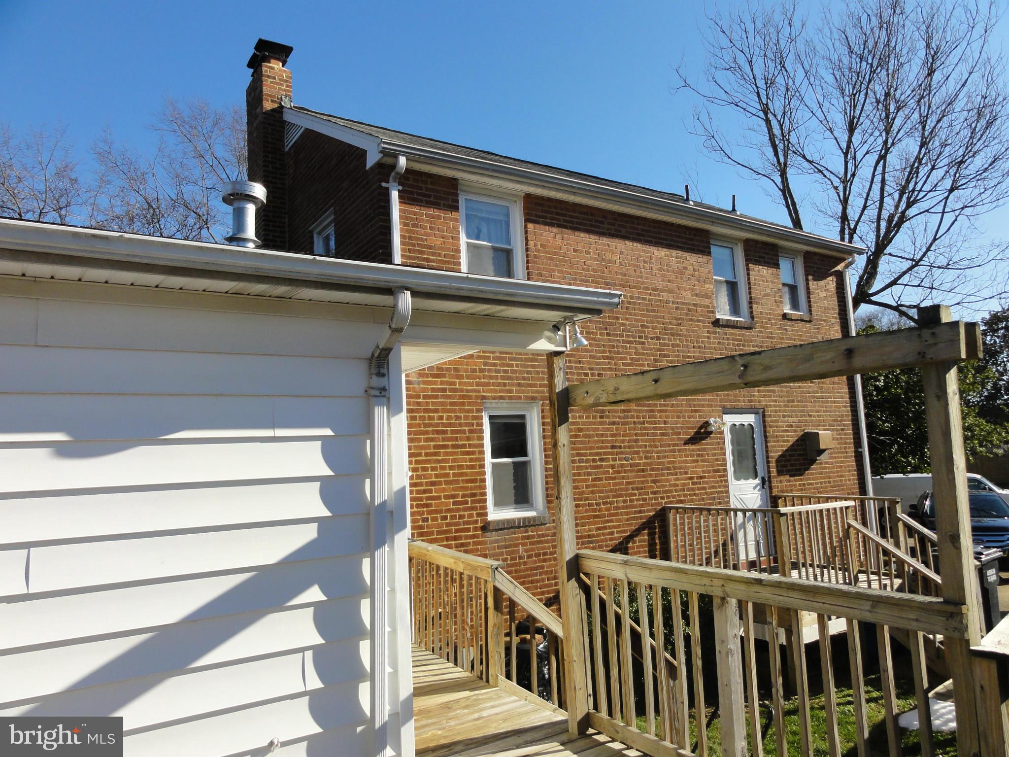 5912 Backlick Road Springfield, VA 22150 - Photo 5 of 28 a front view of a house with a garage