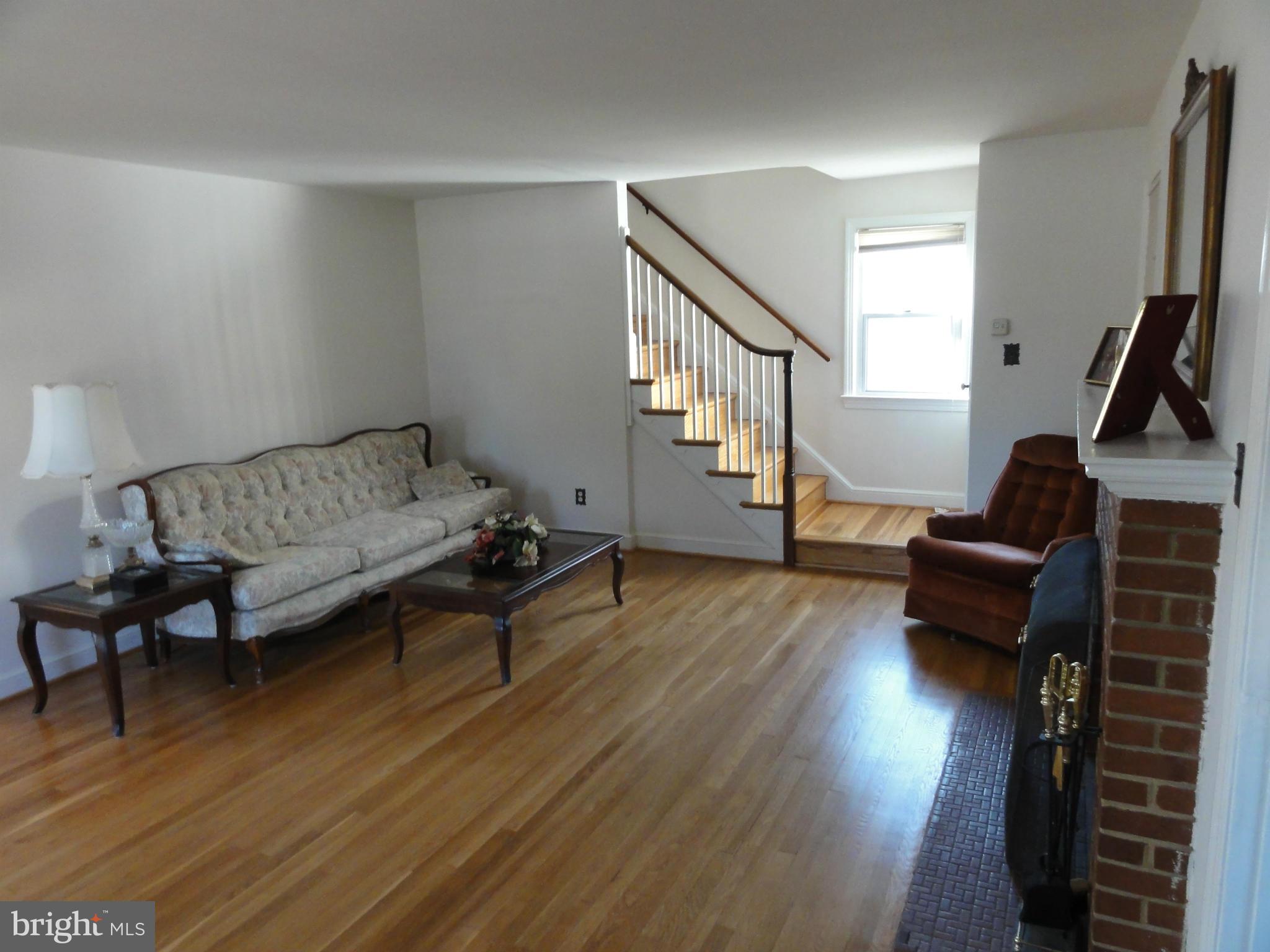 5912 Backlick Road Springfield, VA 22150 - Photo 7 of 28 a living room with furniture and a wooden floor