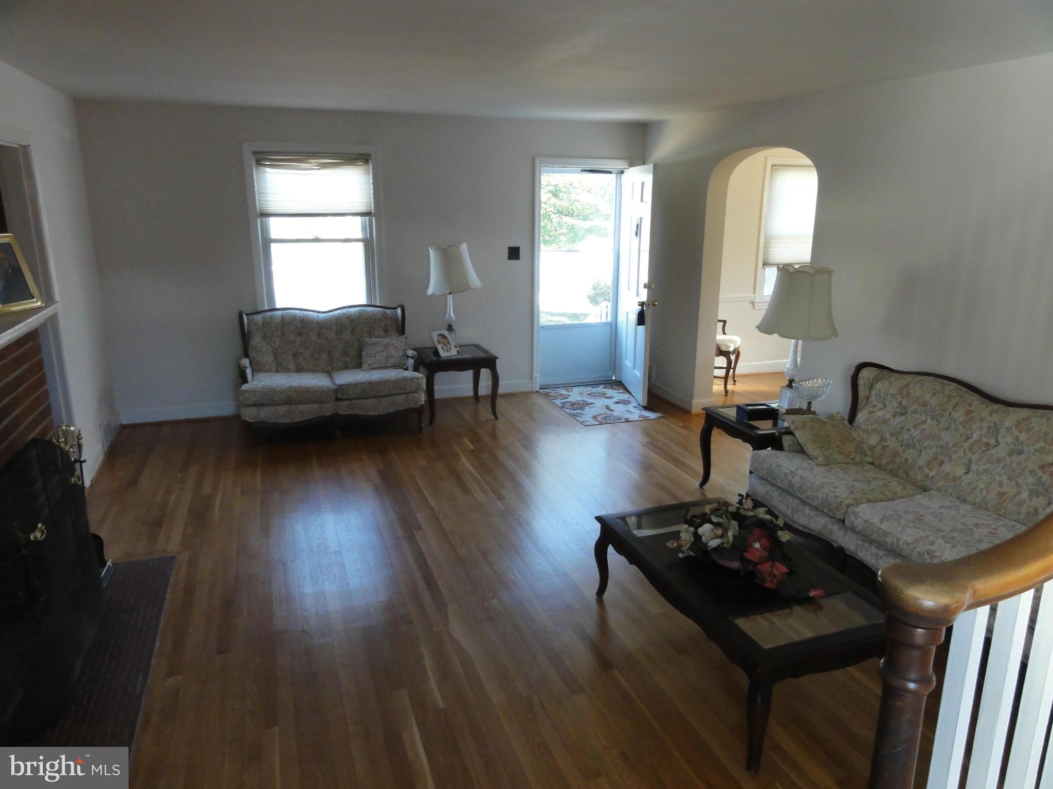 5912 Backlick Road Springfield, VA 22150 - Photo 10 of 28 a living room with furniture and wooden floor