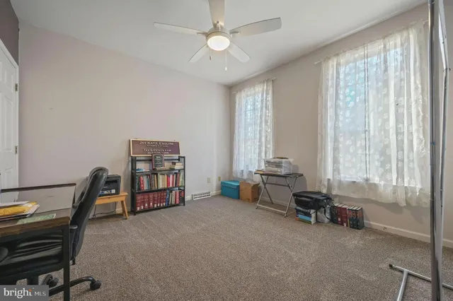 a view of a livingroom with furniture and a window