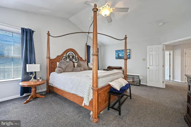 a bedroom with a bed and a table