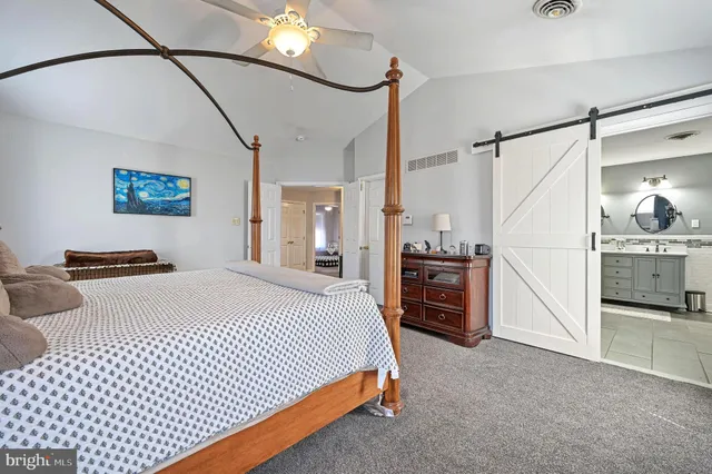 a bed room with a bed and a television