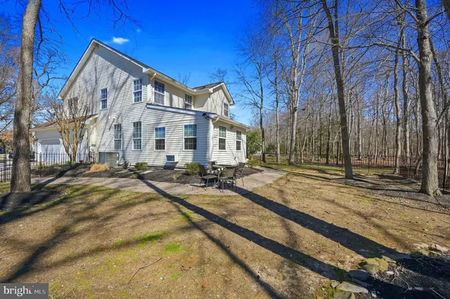 a view of a house with snow on the road