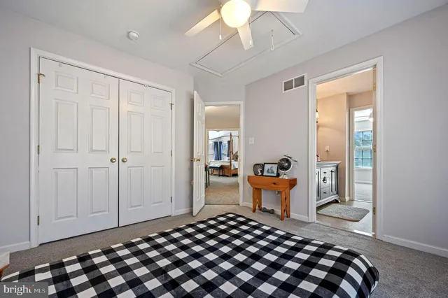 a bedroom with bed and window