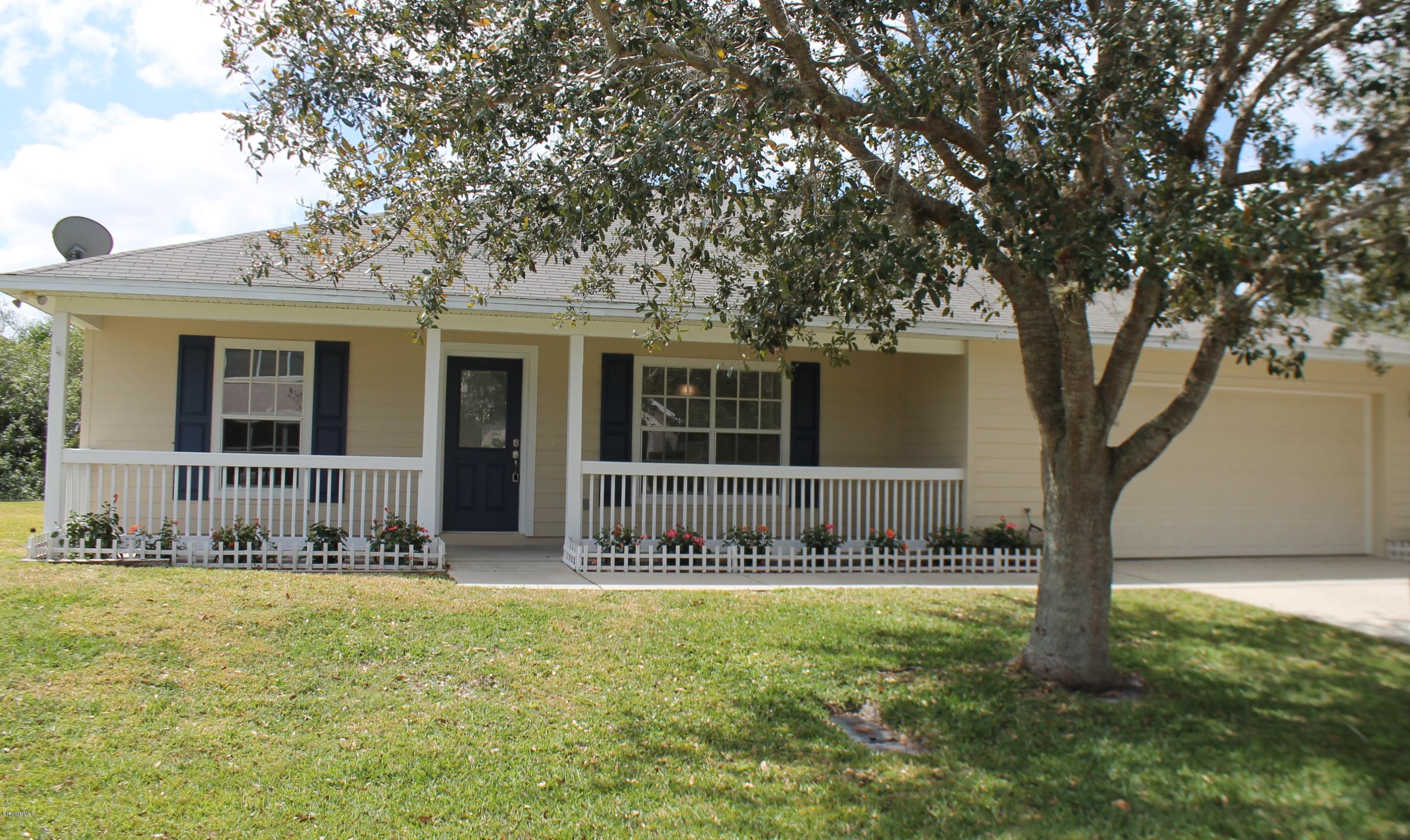 575 Amber Lane Cocoa, FL 32926 - Photo 1 of 16 a view of a house with a yard