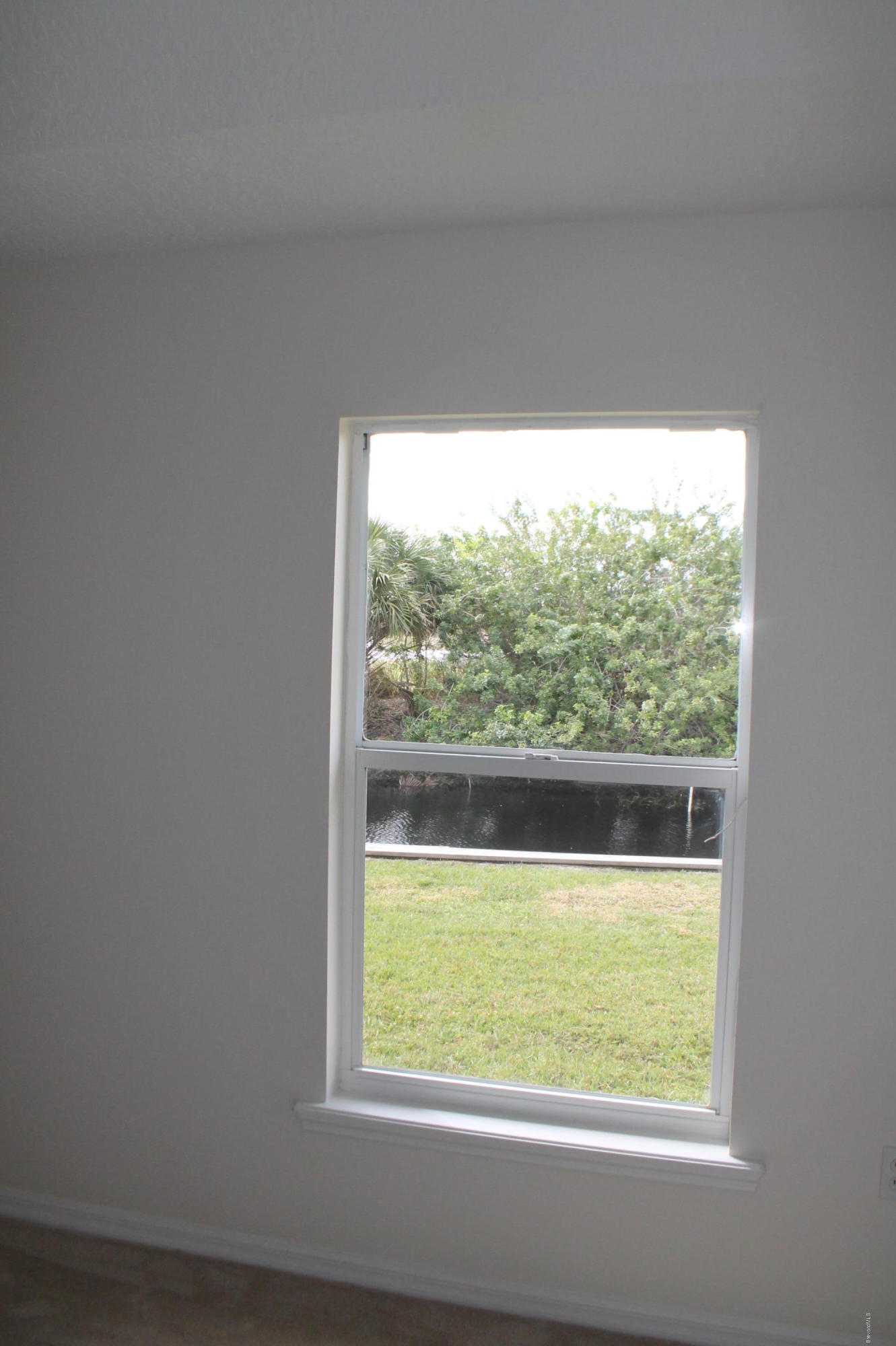 575 Amber Lane Cocoa, FL 32926 - Photo 11 of 16 a view of lot of window of an empty room