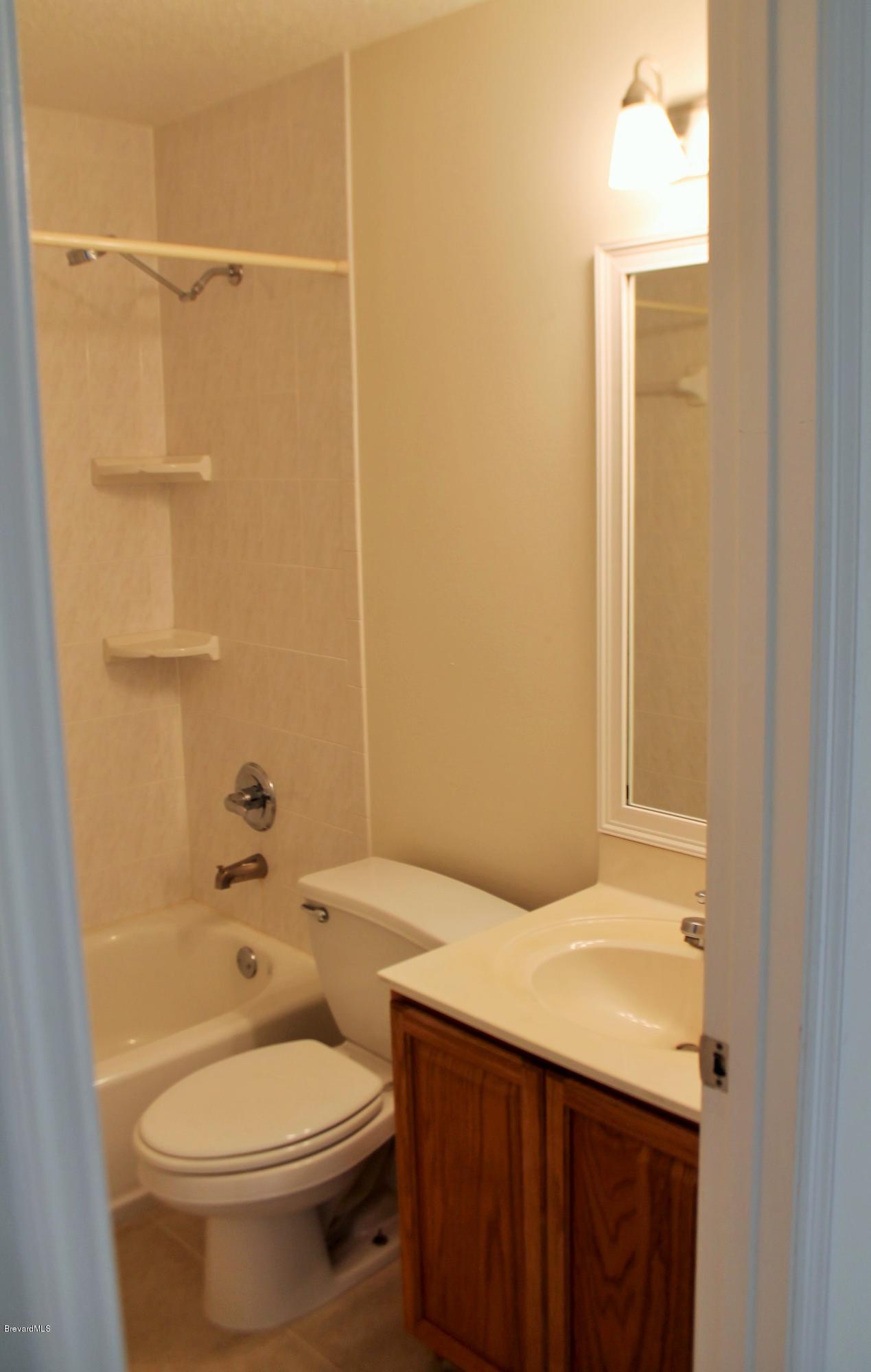 575 Amber Lane Cocoa, FL 32926 - Photo 13 of 16 a bathroom with a sink and toilet