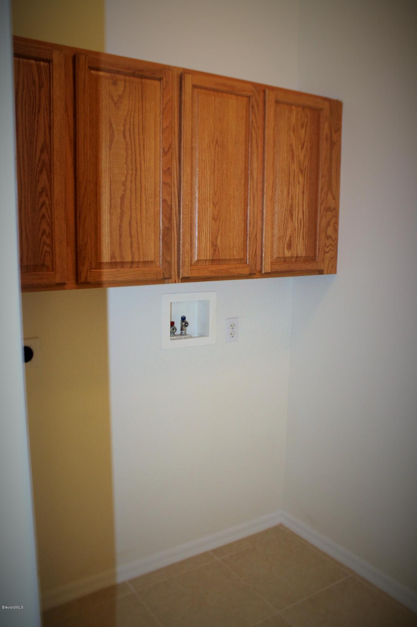 575 Amber Lane Cocoa, FL 32926 - Photo 14 of 16 a view of cupboard