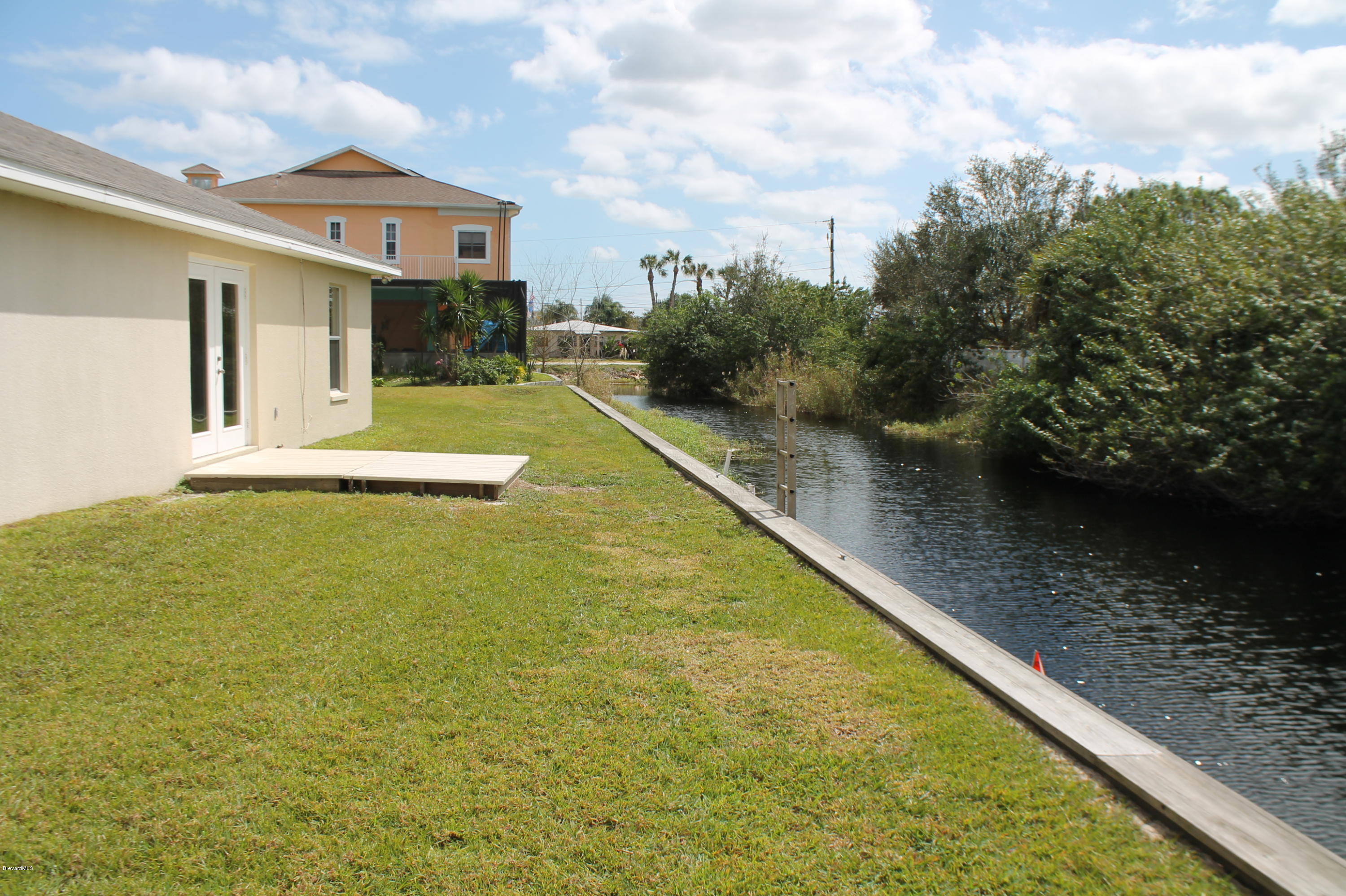 575 Amber Lane Cocoa, FL 32926 - Photo 4 of 16 a view of swimming pool with a yard