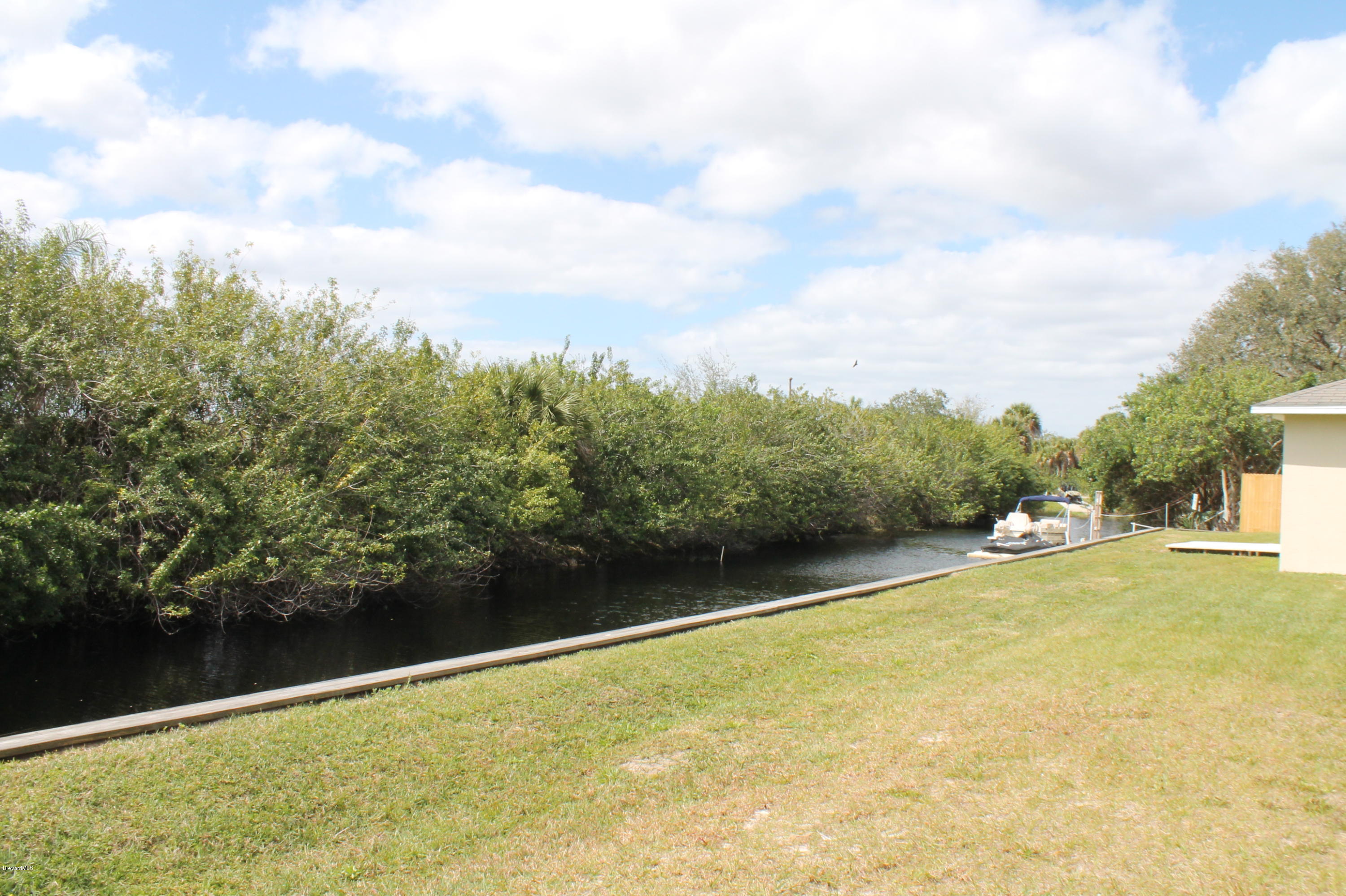 575 Amber Lane Cocoa, FL 32926 - Photo 5 of 16 a view of a lake with trees in the background