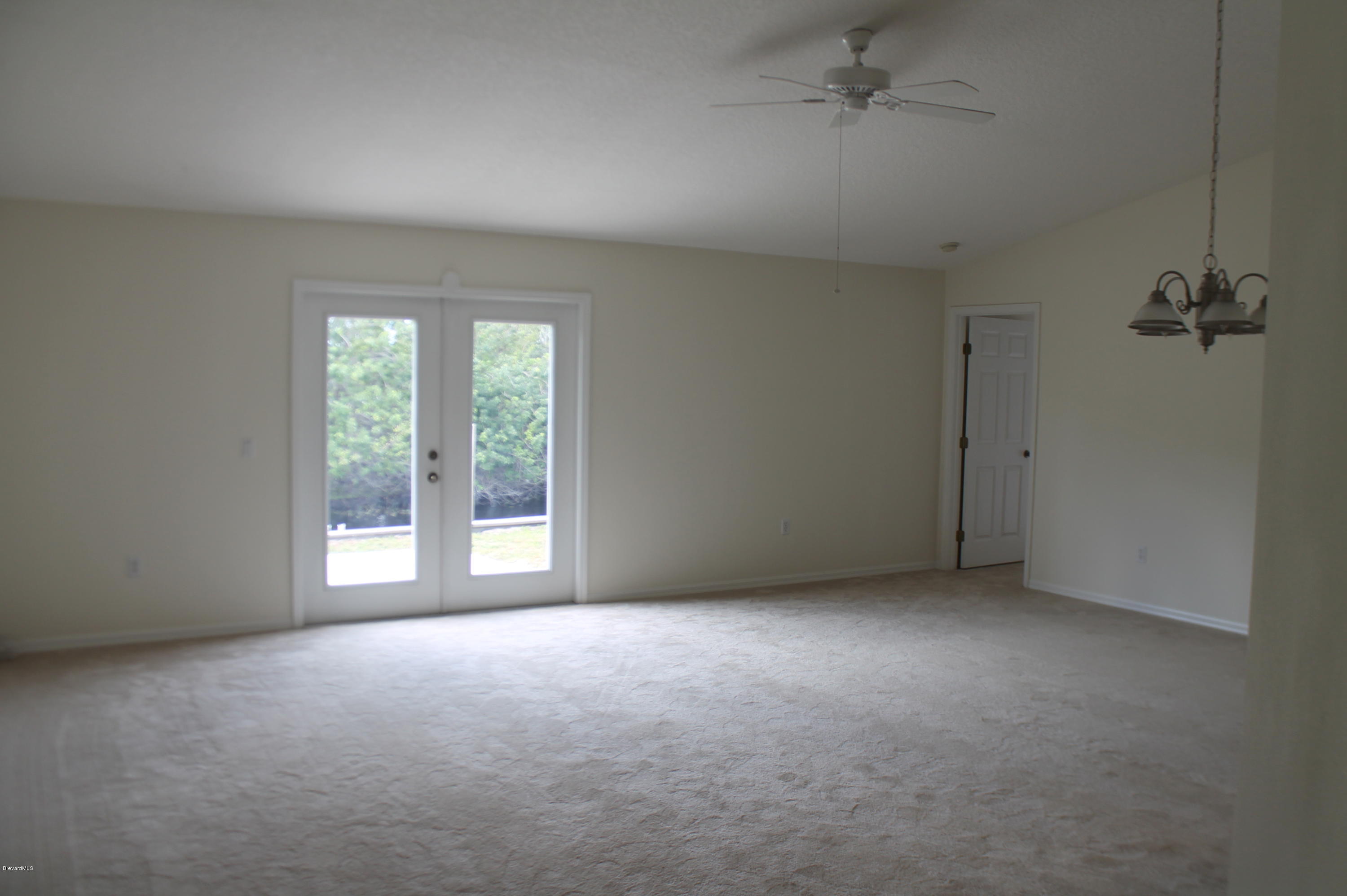 575 Amber Lane Cocoa, FL 32926 - Photo 6 of 16 an empty room with windows
