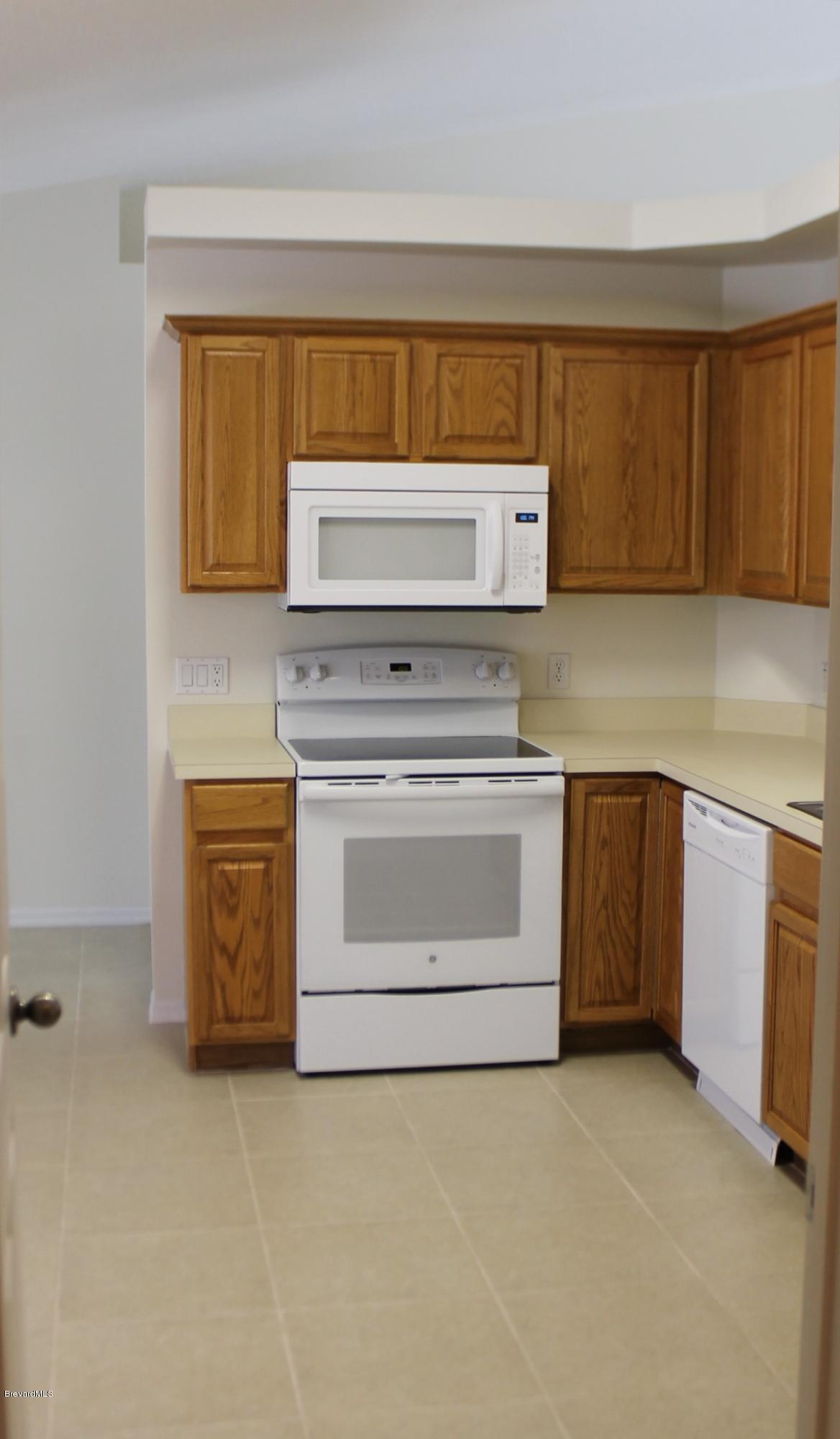 575 Amber Lane Cocoa, FL 32926 - Photo 8 of 16 a kitchen with a stove and a sink