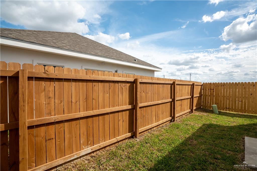 1408 South Xanthia Street, Unit 2 Alton, TX 78573 - Photo 2 of 18 a view of outdoor space with wooden fence