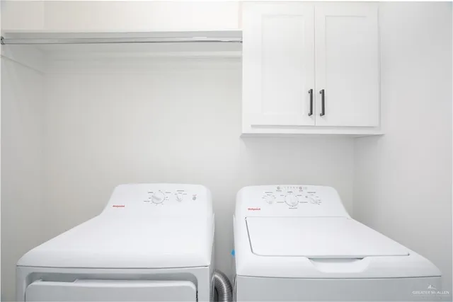 an empty room with a window and a ceiling fan