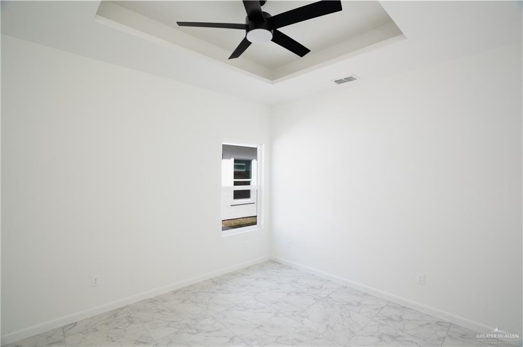 1408 South Xanthia Street, Unit 2 Alton, TX 78573 - Photo 10 of 18 a view of a window in an empty room