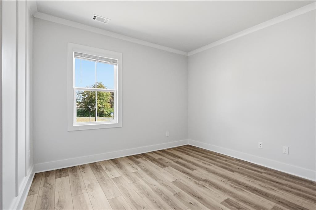 331 Orchid Street Braselton, GA 30517 - Photo 25 of 57 an empty room with a window