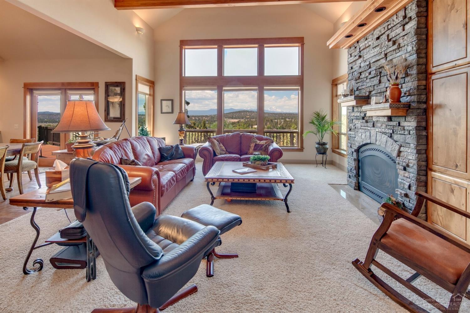 20152 Tumalo Road Bend, OR 97703 - Photo 9 of 25 a living room with furniture and a fireplace