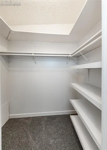 a bathroom with a granite countertop sink a mirror and a bathtub