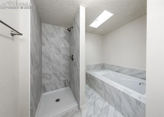 a bath tub sitting next to a white sink