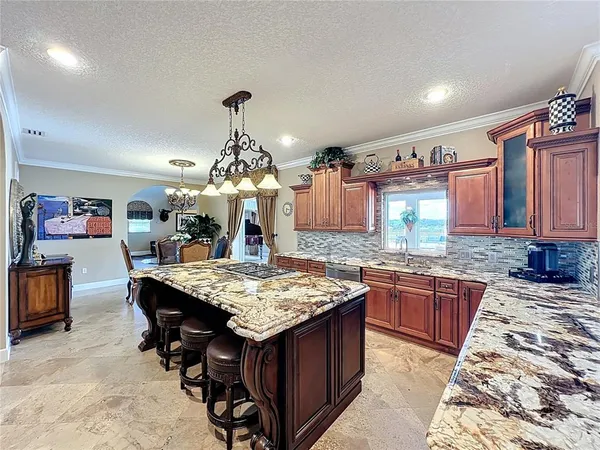 a kitchen island with granite countertop lots of counter top space